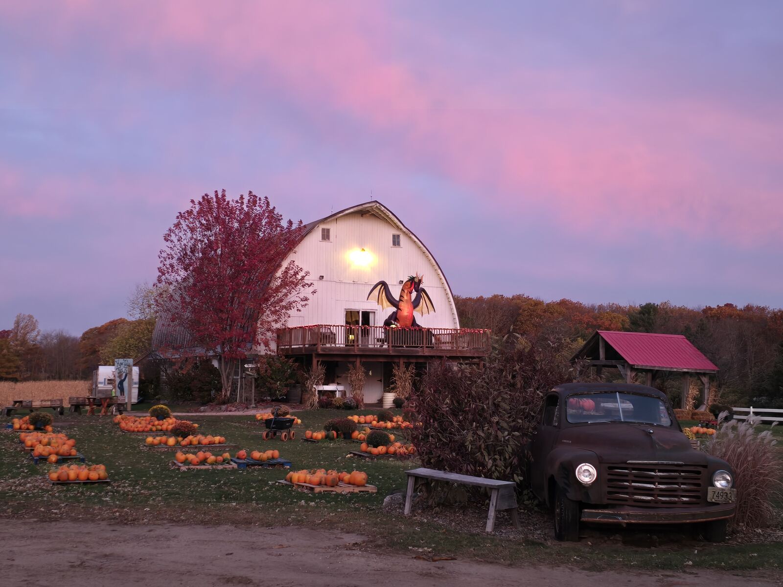 Barn at dusk surrounded by fall color