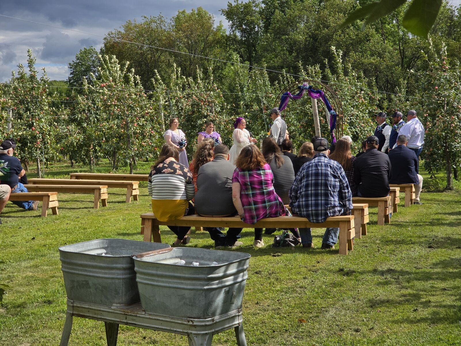 Outdoor wedding ceremony in the apple orchard