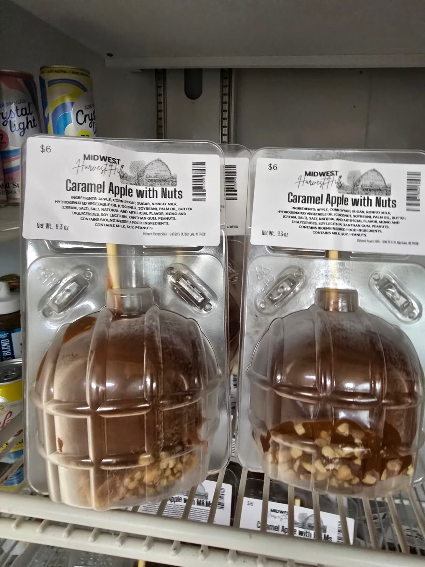 Fresh caramel apples with nuts packaged in the farm cooler