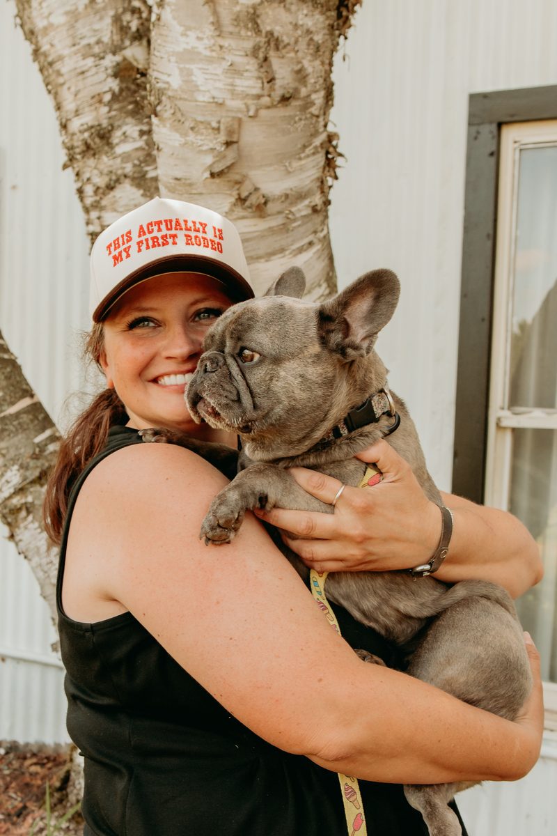 Jackie Dibble, owner of Midwest Harvest Hills, holding her French bulldog